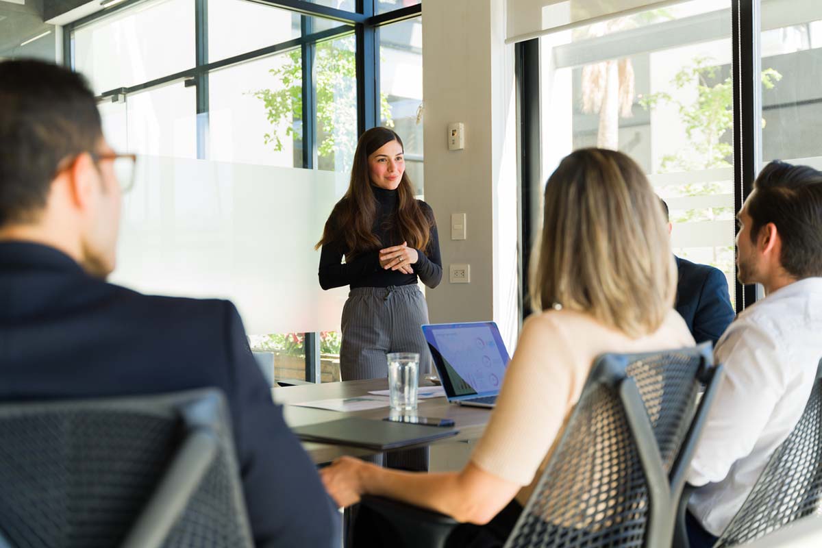 Woman giving a sales presentation to the new decision-maker